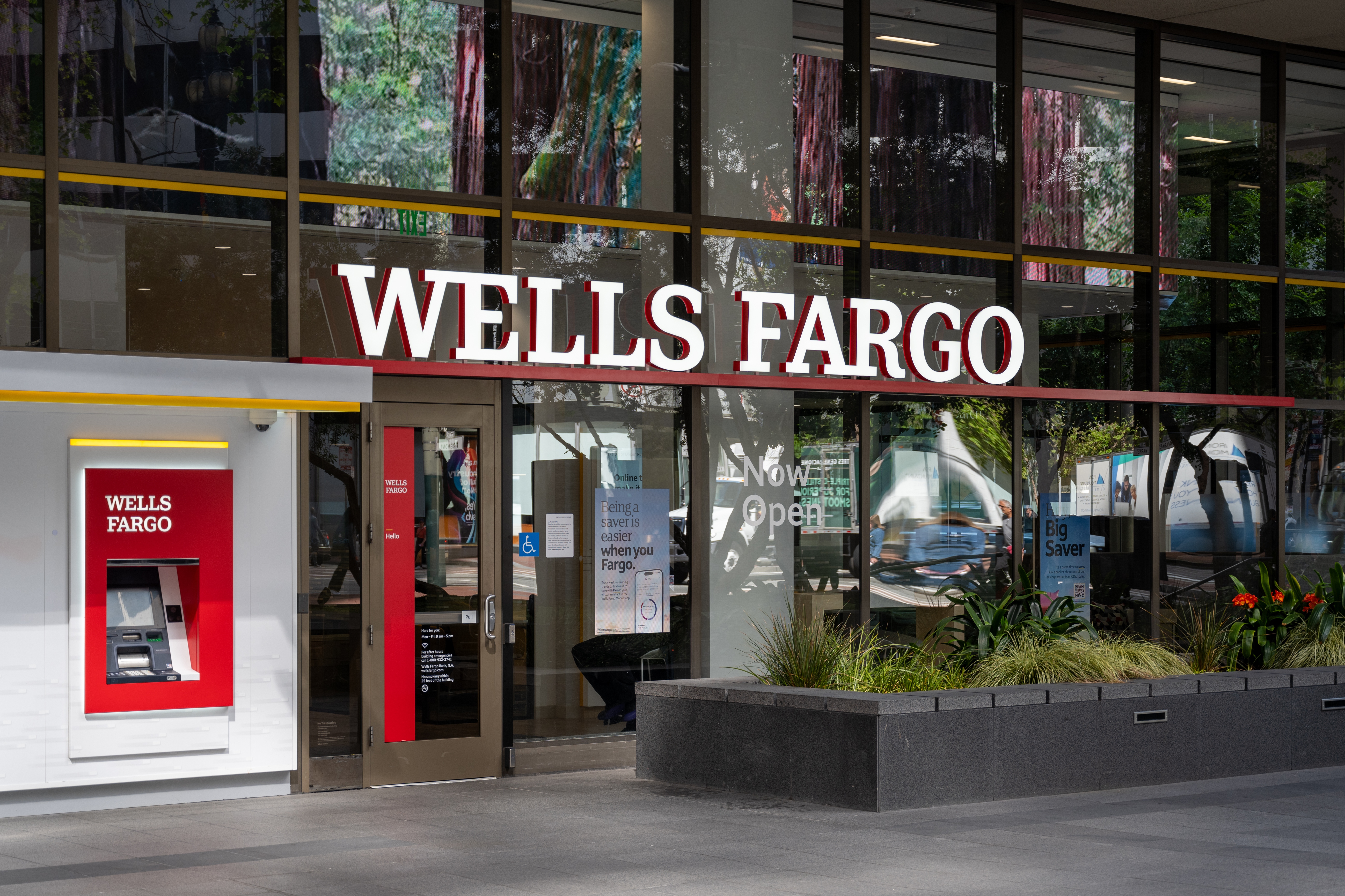 The entrance for a Wells Fargo is shown next to an ATM for the bank.